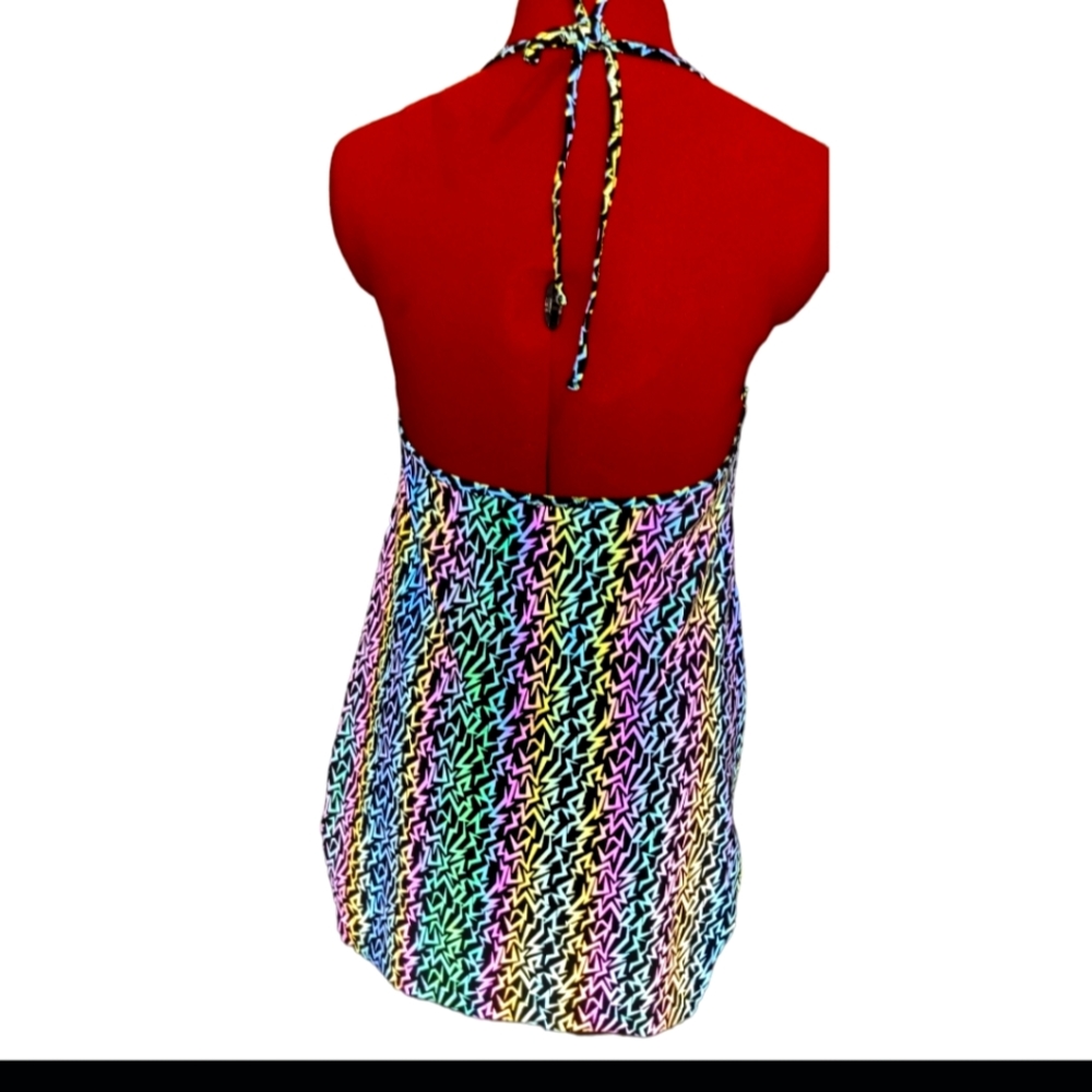 Holographic glows in black light and when light hits it so pretty dress